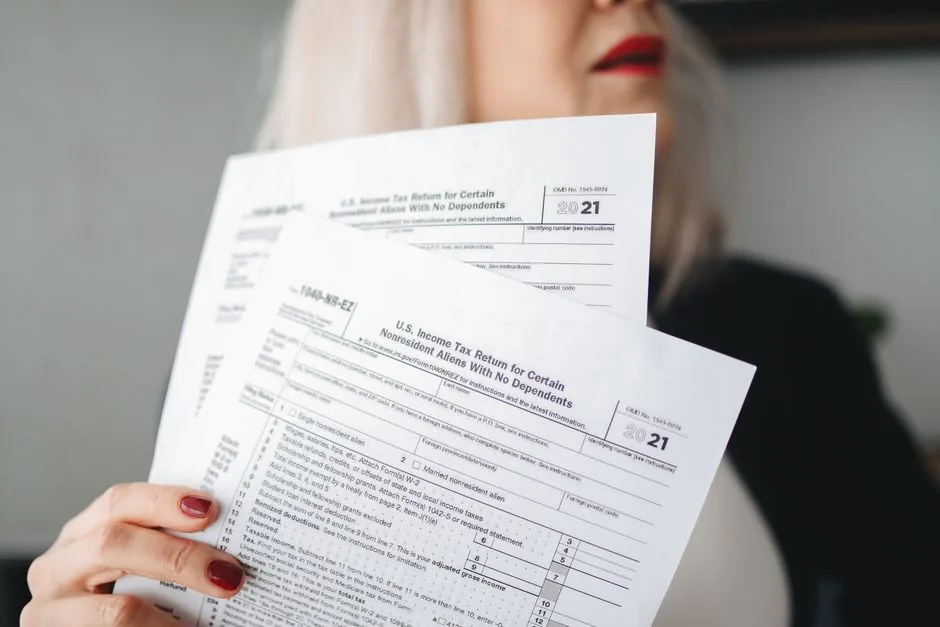 Investor verifying financial records and tax returns Investor verifying financial records and tax returns