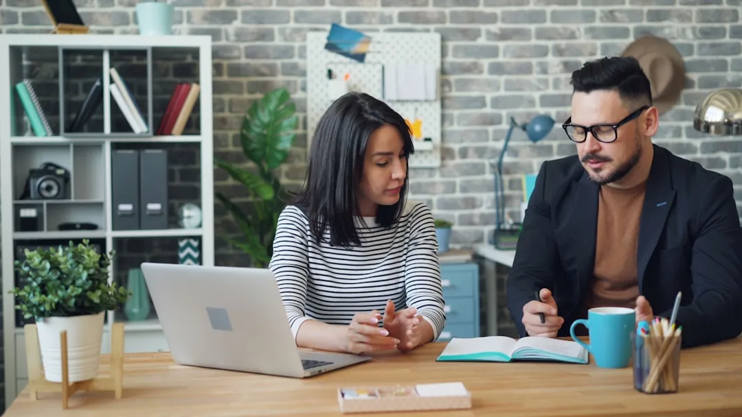Employer and employee discussing compliance
