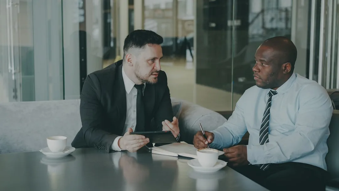 Immigration attorney consulting with a client about visa options Immigration attorney consulting with a client about visa options